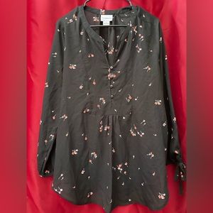 Black blouse with red flowers.